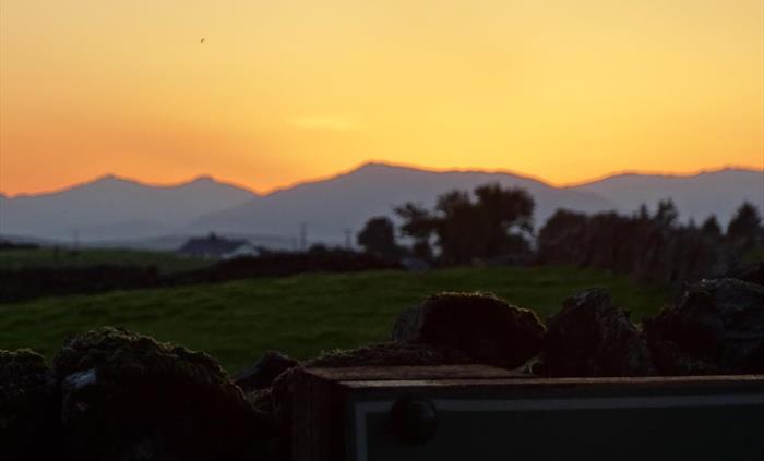 An amazing sun set over Eryri (Snowdonia) National Park taken from the grounds of Llwyn Onn Guest House.